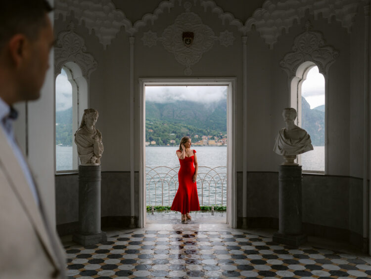 Woman in a red dress at a romantic villa in Lake Como