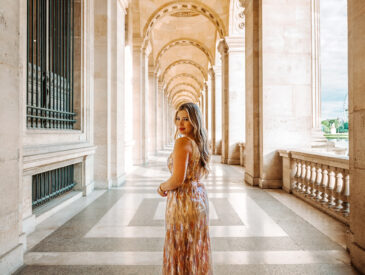 Woman in a chic dress posing at the Louvre in Paris during early morning, part of a fall 2025 Europe outfit guide.