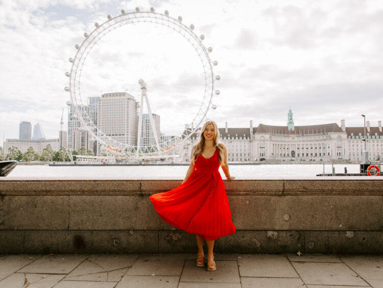 Our Globetrotting creator in a red Revolve dress in London, chic city outfit for UK travel