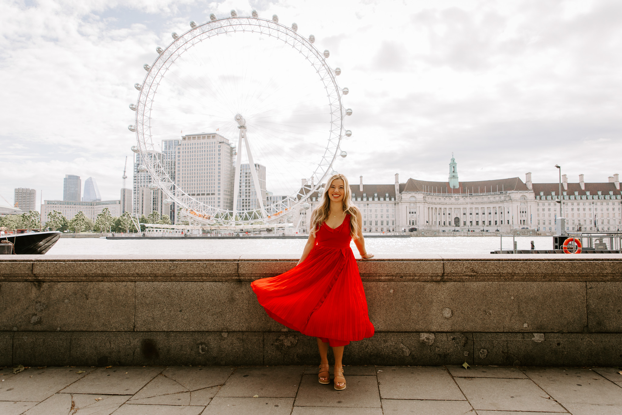 Our Globetrotting creator in a red Revolve dress in London, chic city outfit for UK travel